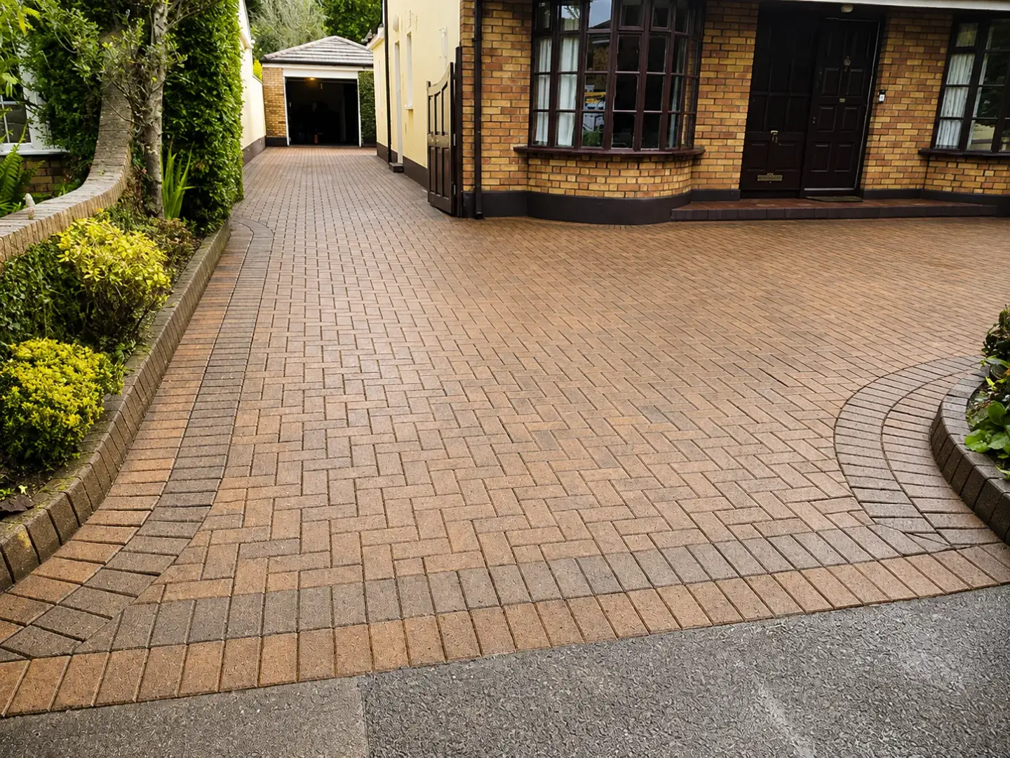 Restored herringbone driveway after cleaning