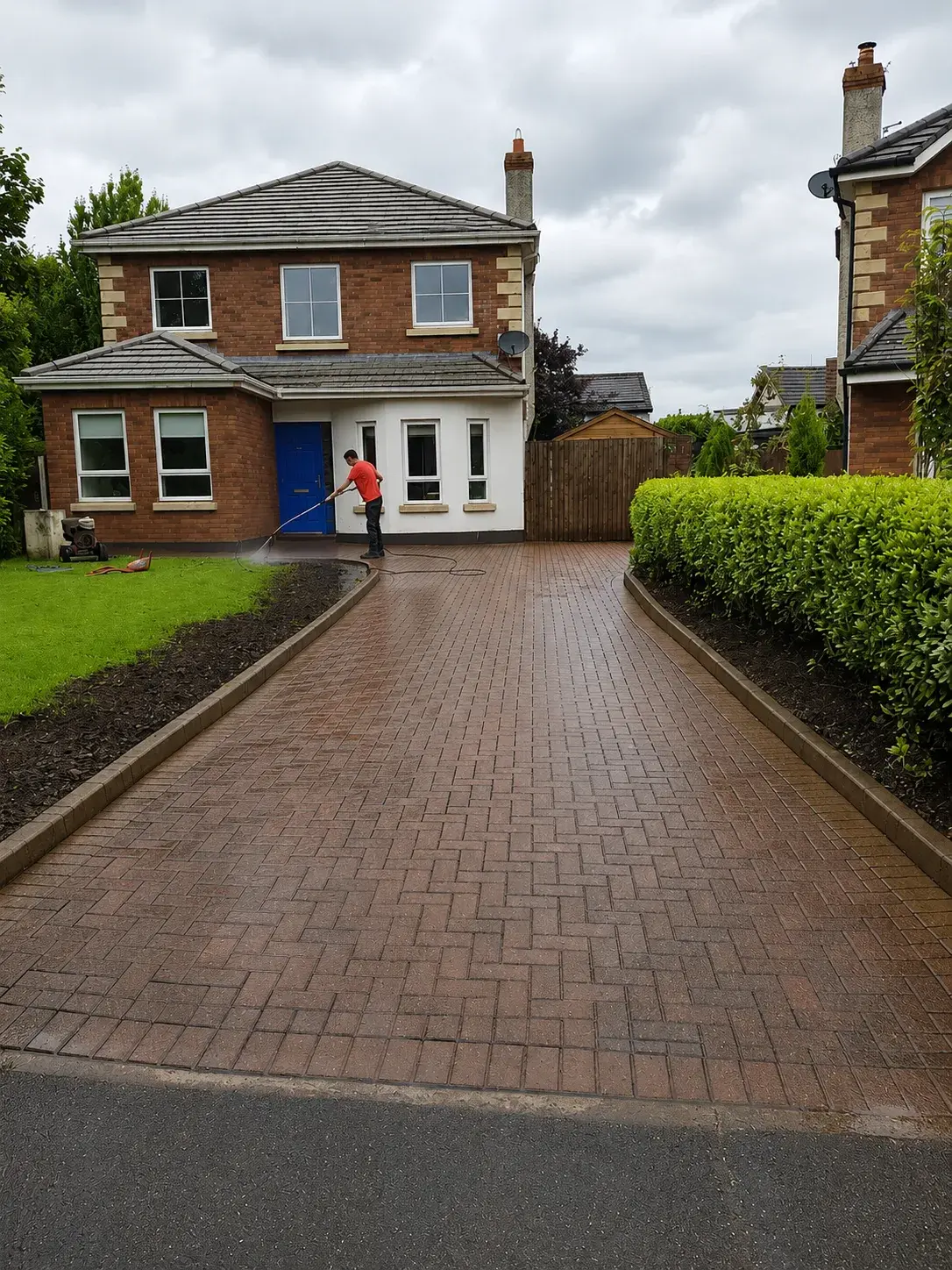 Pressure washing a block-paving driveway