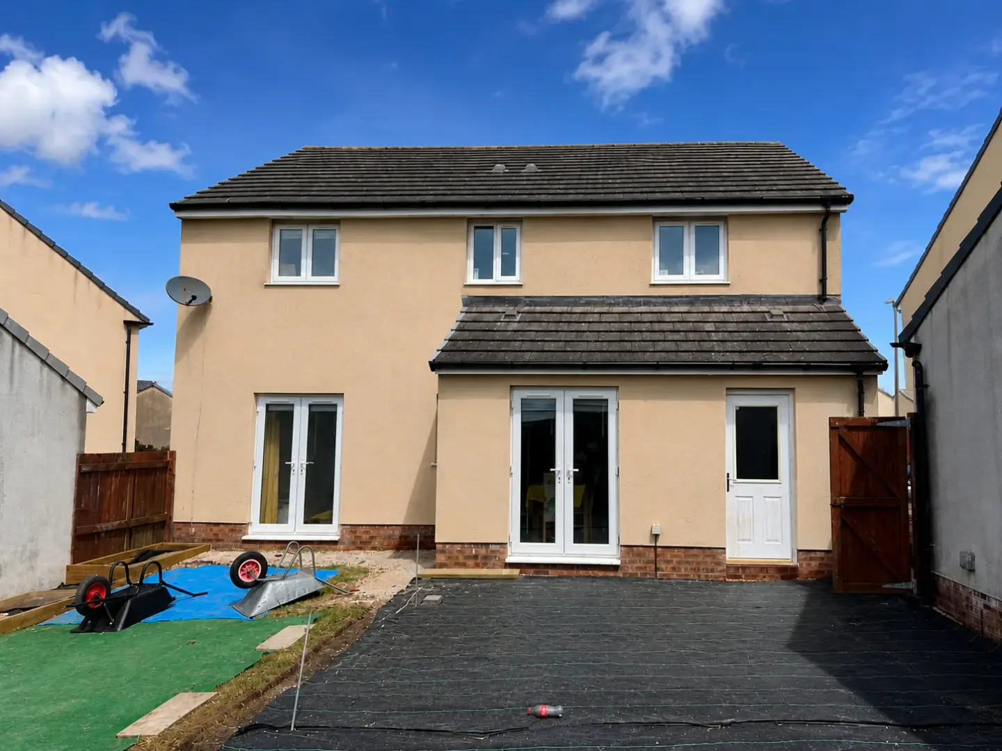 Rear of house render after cleaning, fully restored